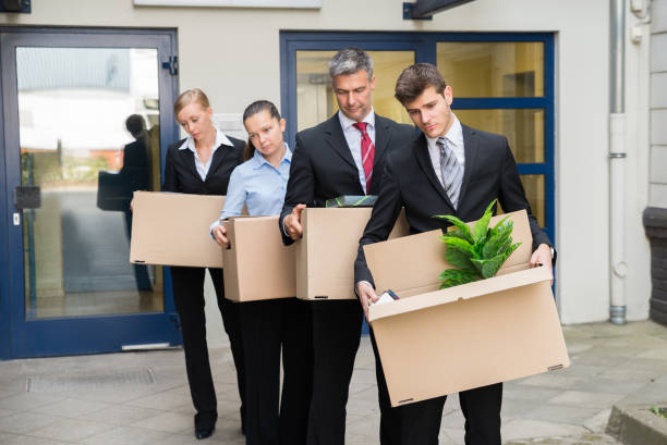 istock Disappointed Businesspeople With Cardboard Boxes 1322670908