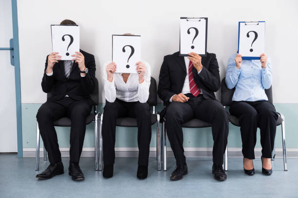 istock Businesspeople Hiding Behind Question Mark Sign 1322670927