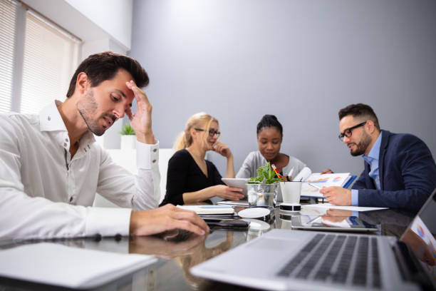 istock Bored Manager Sitting At Presentation In Meeting 1322672215