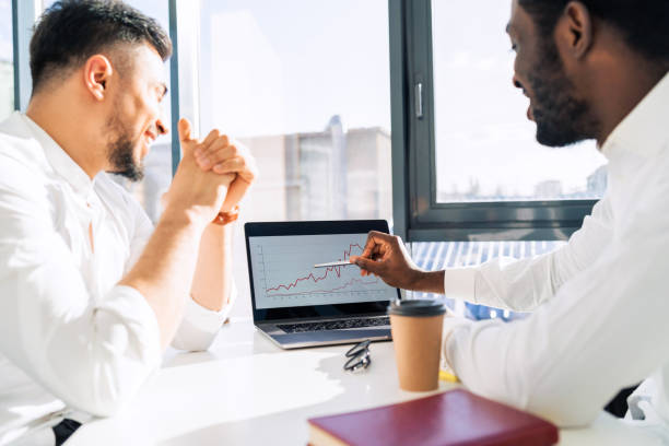 istock Two businessmen watching income graph on laptop 1322672244