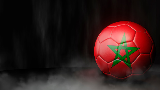 Soccer ball in flag colors on a dark abstract background. Morocco. 3D image.