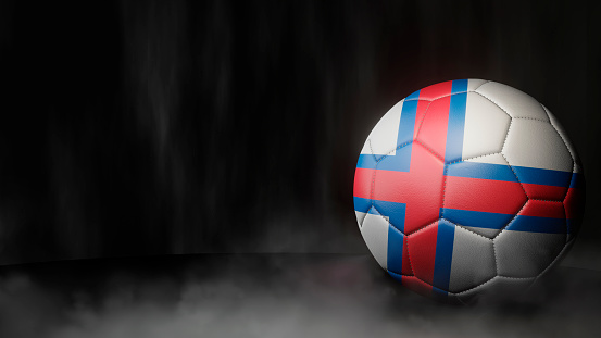 Soccer ball in flag colors on a dark abstract background. Faroe Islands. 3D image.