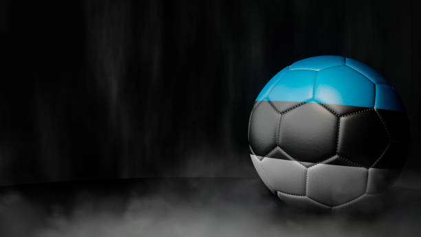pallone da calcio con colori bandiera su sfondo astratto scuro. estonia. - calcio internazionale foto e immagini stock