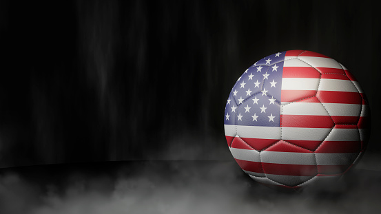 Soccer ball in flag colors on a dark abstract background. USA. 3D image.