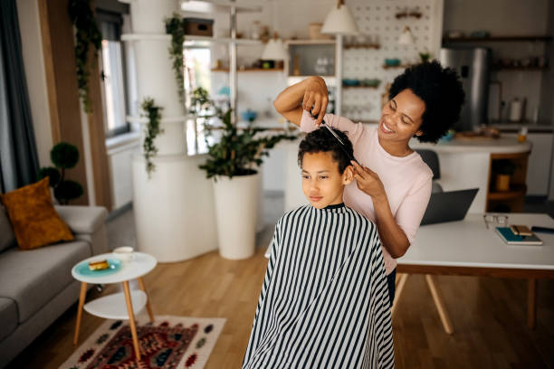 istock Mother giving son haircut 1322676949