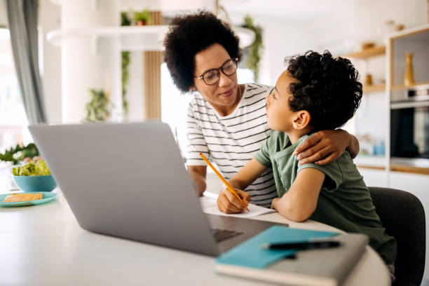 istock Mother helping her teenage son with studying 1322678253