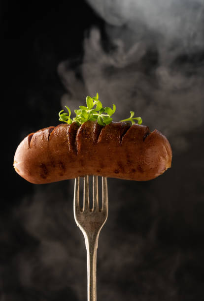 istock selective focus, grilled sausage with steam 1322678690