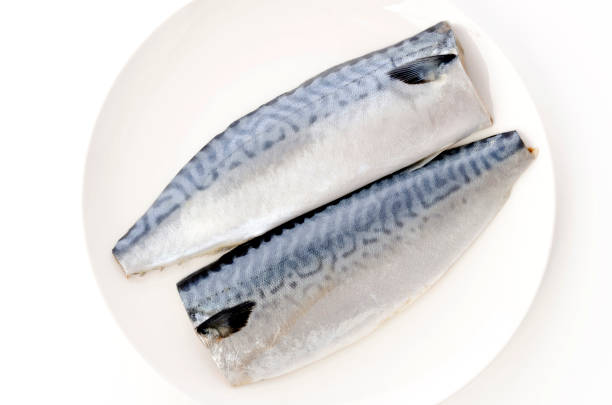 istock Salted fish mackerel fillet on white plate 1322679992