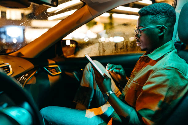 istock Young handsome businessman working from his car 1322680099