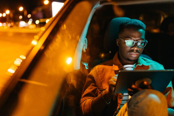 istock Young handsome businessman working from his car 1322680174