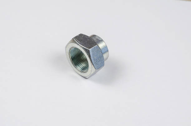 istock Auto parts. Hub nut on white background. New Silver front car hub nut. 1322680265