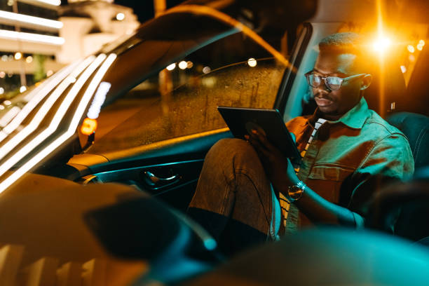 istock Young handsome businessman working from his car 1322680353