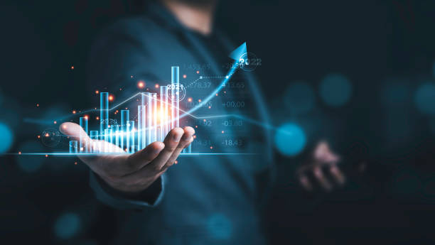 istock Businessman holding virtual technical graph and chart for analysis , stock market and trader concept. 1322682443