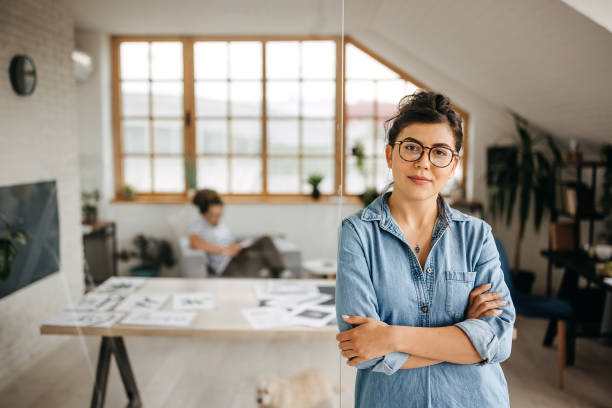istock Young female graphic designer posing at her new office setup 1322682607
