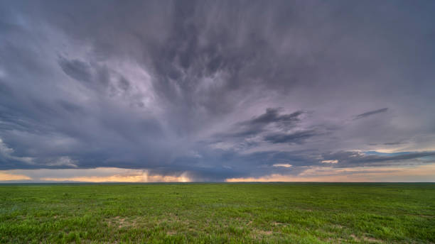 istock heavy storm cloud over green prairie 1322684317
