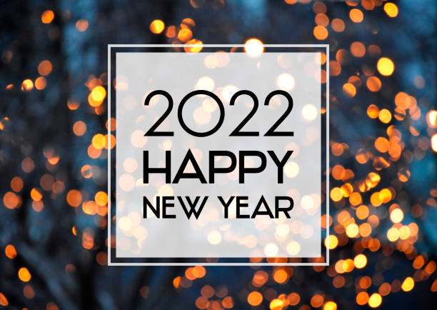 2022 Happy New Year christmas golden bokeh lights background frame stock images 2022 New Year sign on a glowing background. Happy New Year 2022 night defocused lights texture greeting card images new years eve stock pictures, royalty-free photos & images