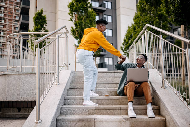 istock Young friends greeting in public park 1322684700