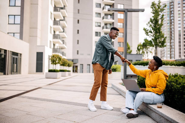 istock Young friends greeting in public park 1322684760