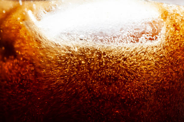 istock close-up bubbles and ice in a coke glass 1322685877