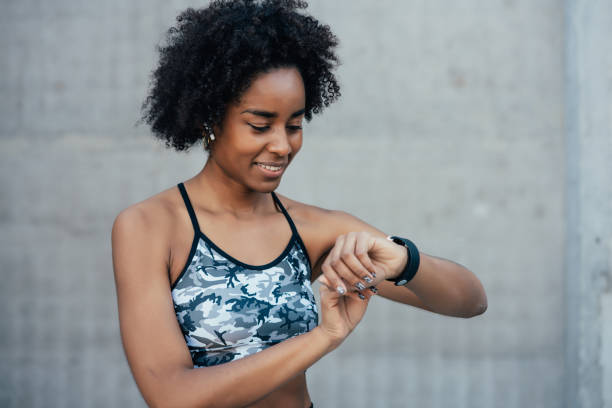 istock Fitness woman checking time on smart watch. 1322688871