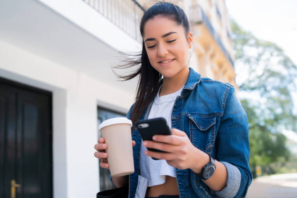 istock Young woman using her mobile phone. 1322690303