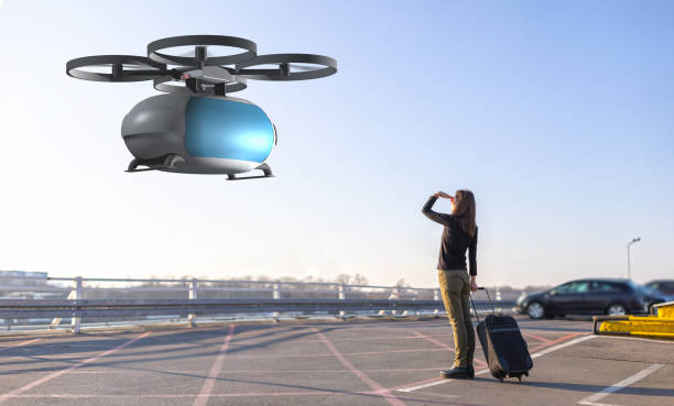 woman waiting for passenger drone transport flying transportation drone picking up a passenger helicopter modern stock pictures, royalty-free photos & images
