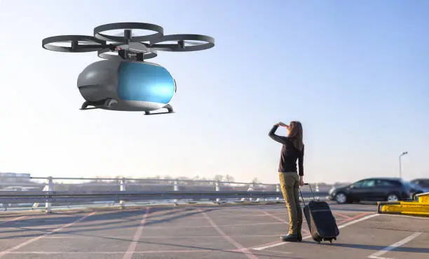 Photo of woman waiting for passenger drone transport