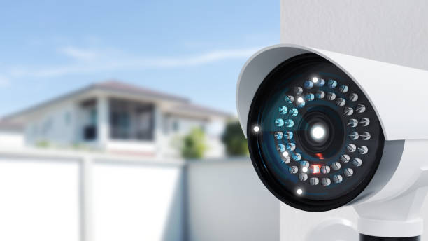 istock CCTV camera safety system on white wall concrete. Security camera CCTV in office, Safety cam system in the home. 3d render. 1322692037