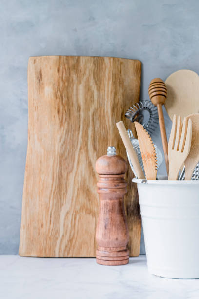 istock Wooden kitchen background with kitchen utensils 1322692216