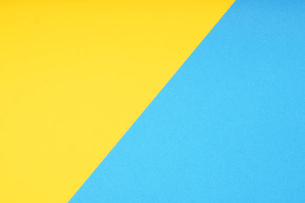 istock two color paper background in yellow and blue 1322693178