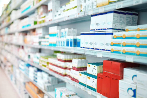 Cropped shot of shelves stocked with various medicinal products in a pharmacy The shelves are stocked chemist stock pictures, royalty-free photos & images