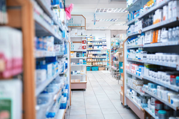 Cropped shot of shelves stocked with various medicinal products in a pharmacy There's medication on these aisles aisle stock pictures, royalty-free photos & images