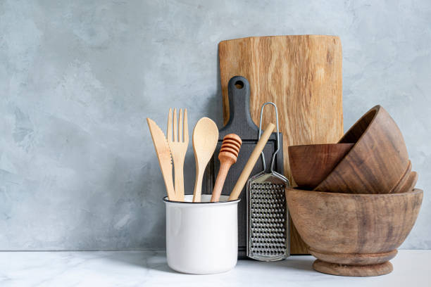 istock Wooden kitchen background with kitchen utensils 1322694293