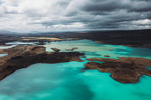 Scenic aerial view of the turquoise mountain lake and small islands in Iceland