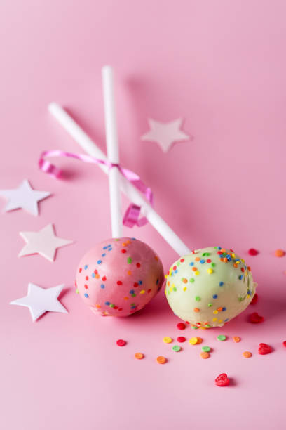 istock Modern Dessert Cake Pops Tasty Dessert Pink Background Vertical 1322696379