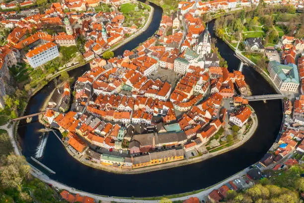 Panoramic view from above of amazing touristic old town Cesky Krumlov and river Vltava, Czech Republic.