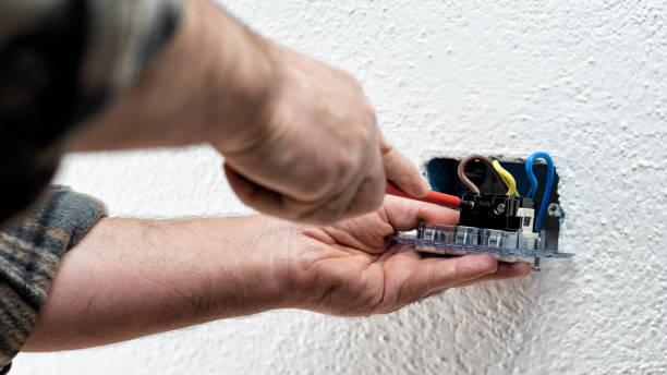 istock Electrician at work on a residential electrical system. Electricity. 1322699168