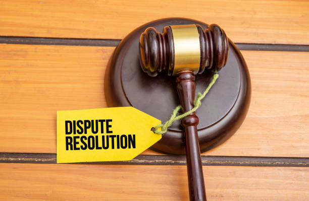istock Dispute Resolution tag on wooden gavel 1322699433
