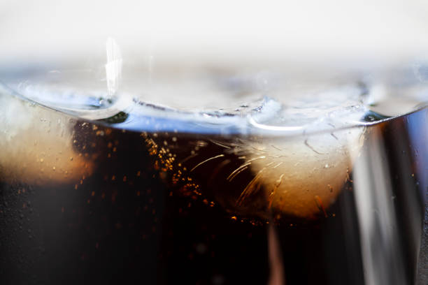 istock close-up bubbles and ice in a coke glass 1322699566