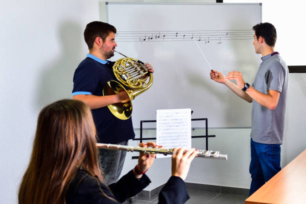 istock Teacher corrects music in the classroom 1322705724