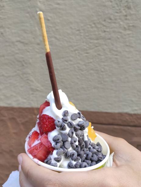 istock Ice cream on a bowl with strawberries 1322705757