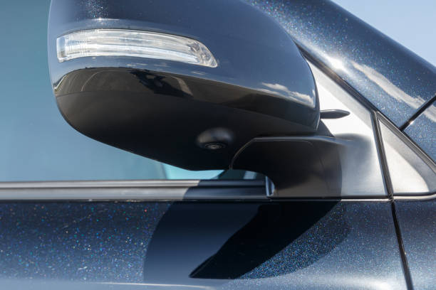 istock Right side foldable mirror with led turning signal integrated. 360 view camera. Black metallic paint. New car technology-parking assistance. Close-up photo. All-round view system 1322708911