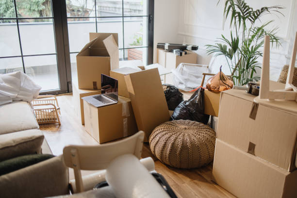 istock Empty room full of cardboard boxes 1322709125