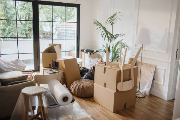 istock Empty room full of cardboard boxes 1322709130