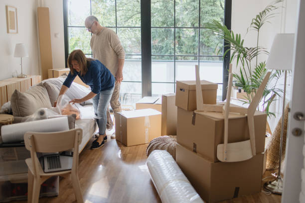 istock A senior couple packing boxes inside a house. 1322709163