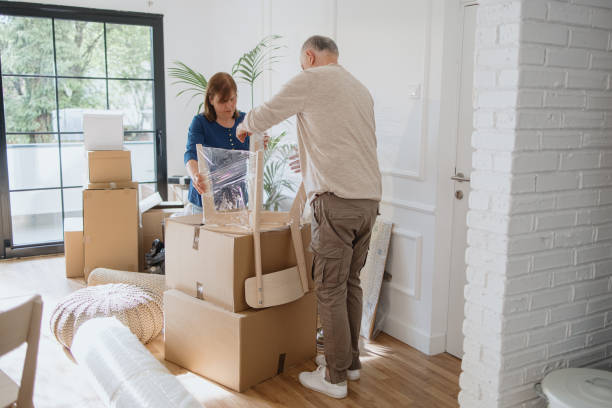 istock Senior couple is wrapping chairs for transport 1322709171