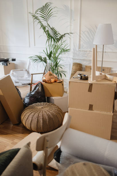istock Empty room full of cardboard boxes 1322709229