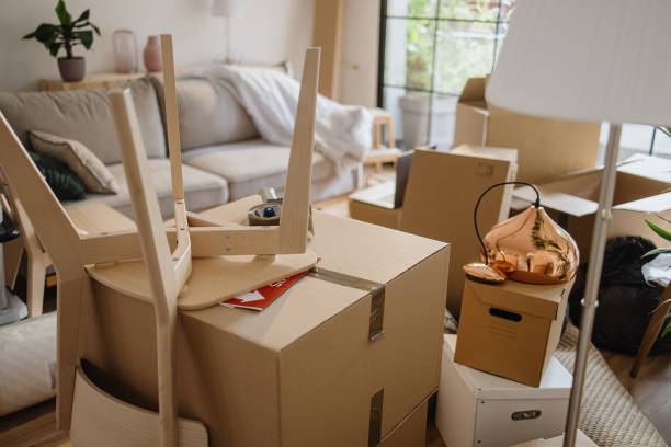 istock Empty room full of cardboard boxes 1322709342
