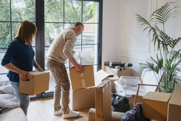 istock A senior couple packing boxes inside a house. 1322709371