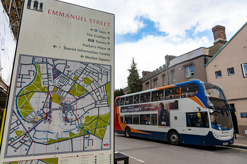 St Andrew's Street Cambridge, England, UK. One of the main shopping streets in Cambridge. The sign in the foreground is on the junction with Emmanuel street with a double decker bus in the background.